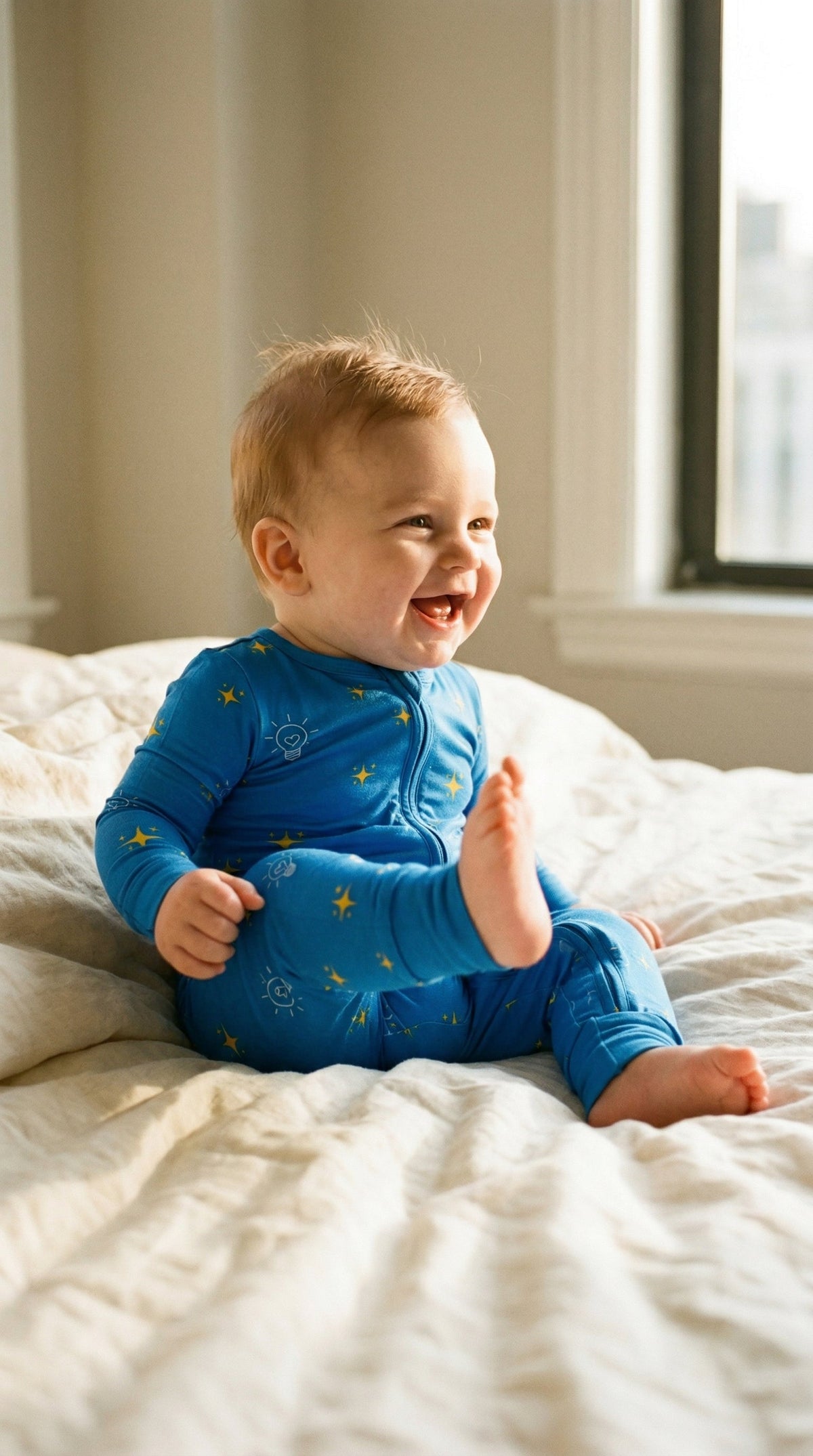 Light of the World print bamboo baby pajama by Lora Baby